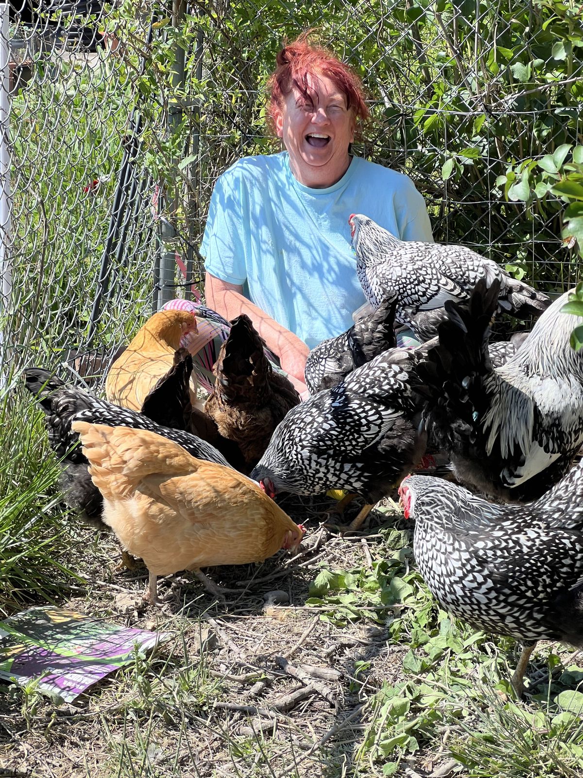 Beth Ann with chickens and farm animals